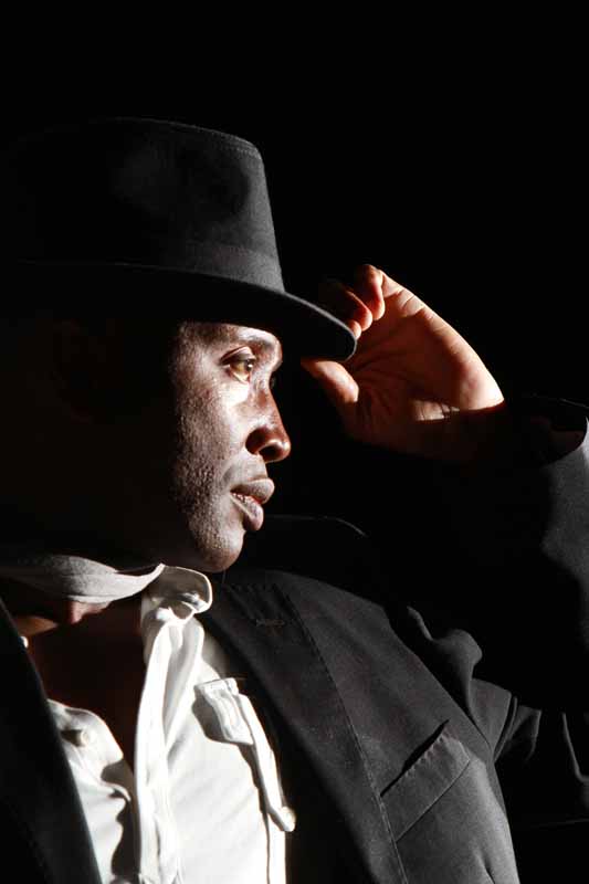 Portrait of Mister Kibs wearing his signature hat